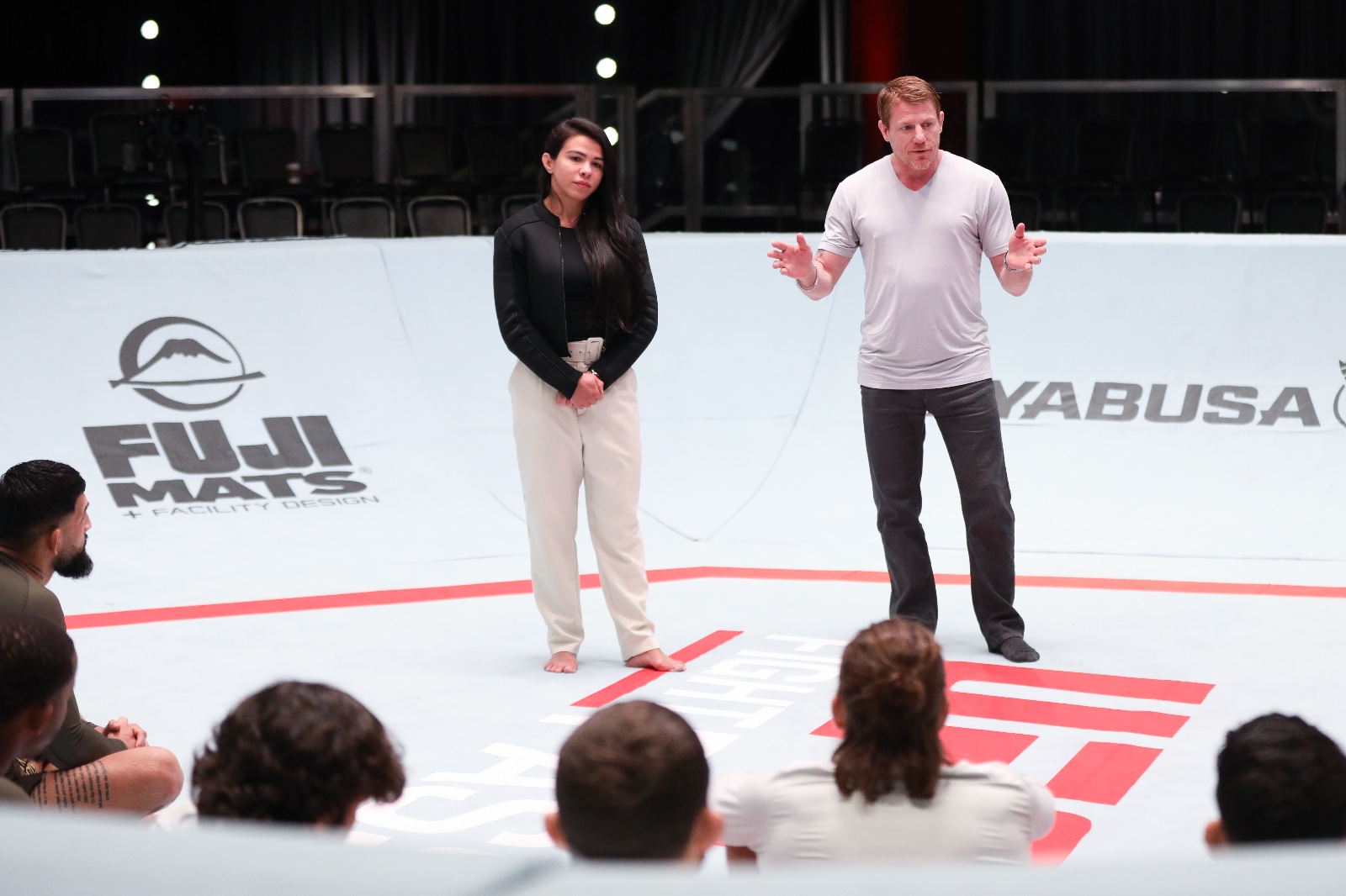 Claudia teaching and presenting to an audience