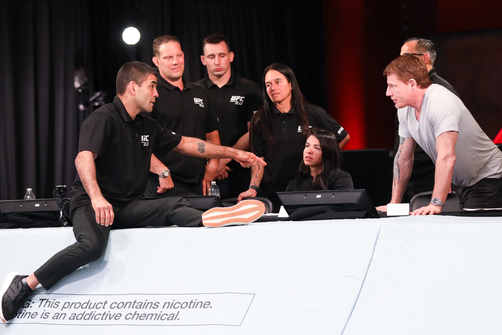 Claudia as UFC executive in corporate environment